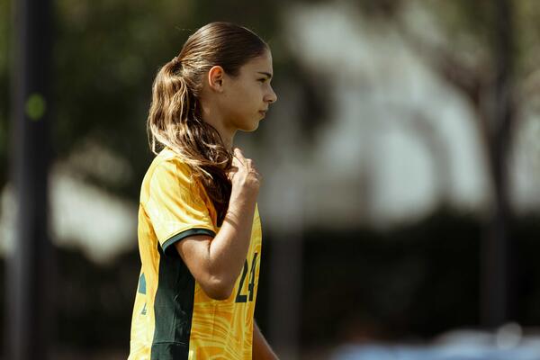 Indiana Dos Santos kicking a football 